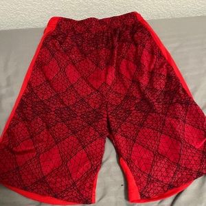 Two pairs of boy basketball shorts